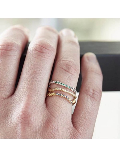 Anais Rheiner stacking white gold ring and emeralds